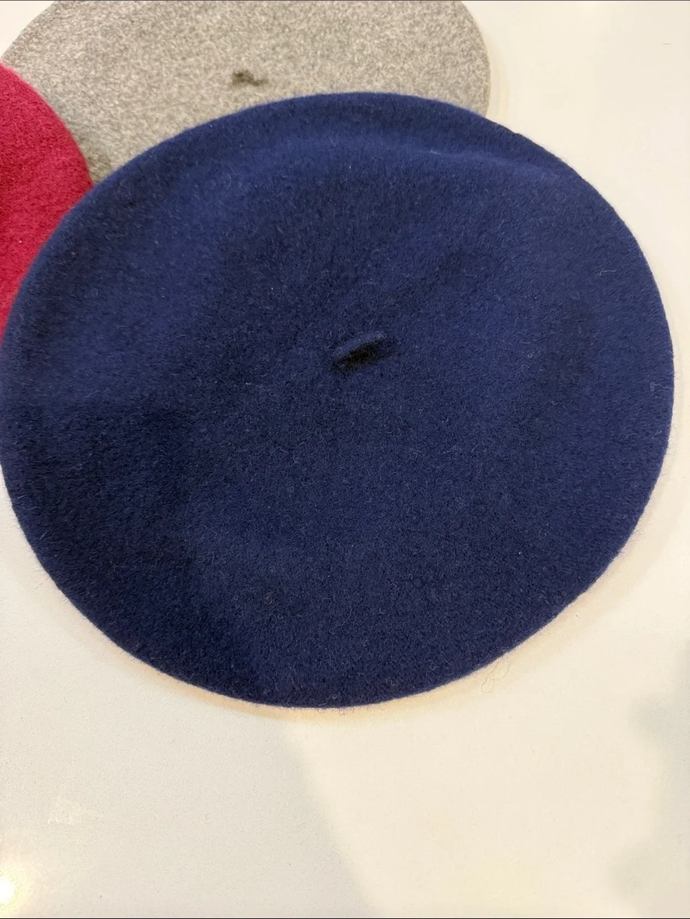 Three Wool Berets in Navy, Burgundy, and Gray